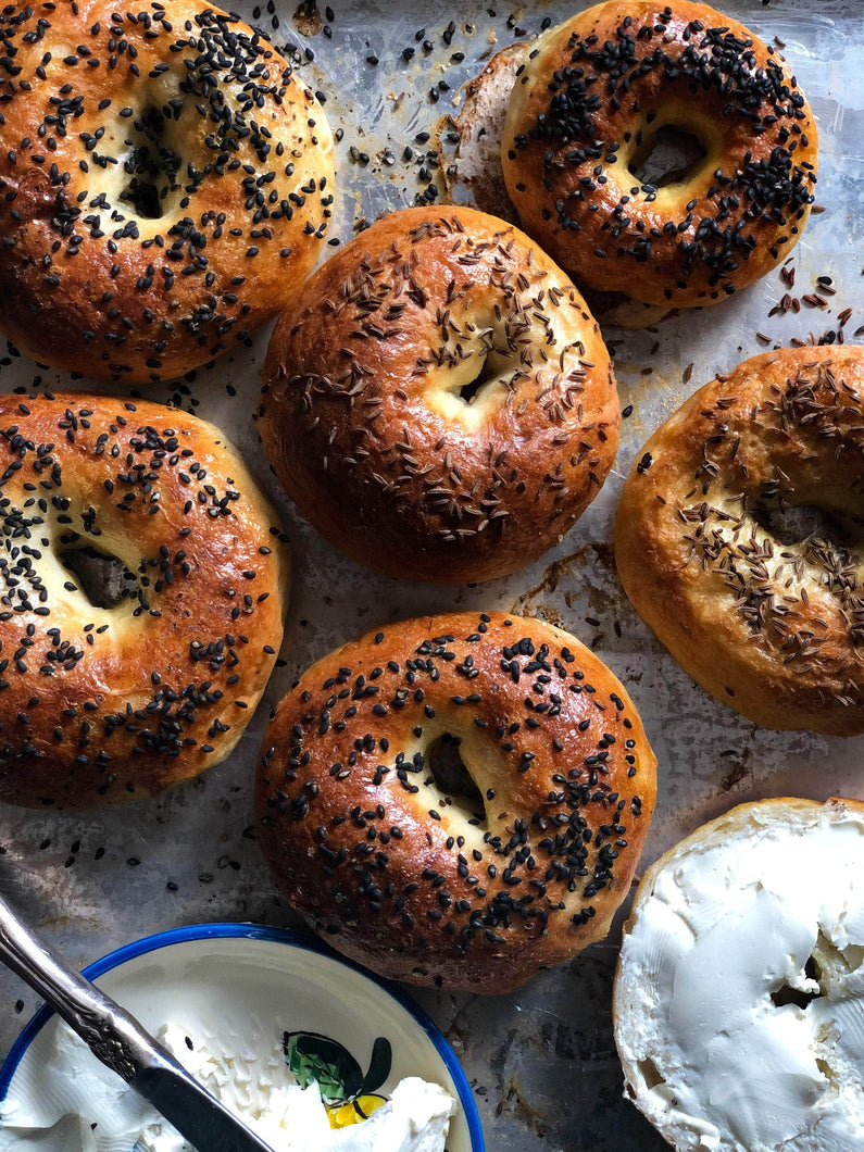 Bagels On A Tray With Spreads - Featured Image